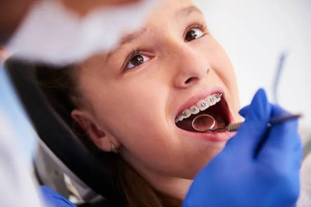 dental check-up of a girl with braces